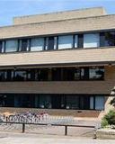 English faculty building with bike racks in front